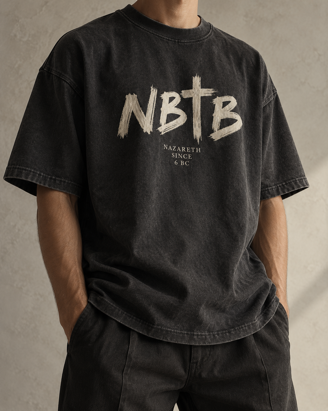 Concept preview of a charcoal NBTB tee with an ivory cross wordmark